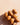 Argan nuts on a warm peach surface