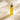 Mimane Glow Growth and Strengthen Hair Oil bottle in warm window light