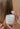 Hands scooping Mimane Glow Hydrate and Strengthen Hair Mask from the jar