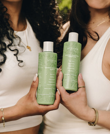 Models holding Mimane Glow Nourish and Strengthen Shampoo and Conditioner Duo — natural hair care set