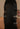 Long straight black hair sectioned with clips and a comb, seen from behind