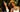 Two women with healthy hair, one with long dark lengths and one with curls, outdoors