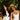 Two women with healthy hair, one with long dark lengths and one with curls, outdoors